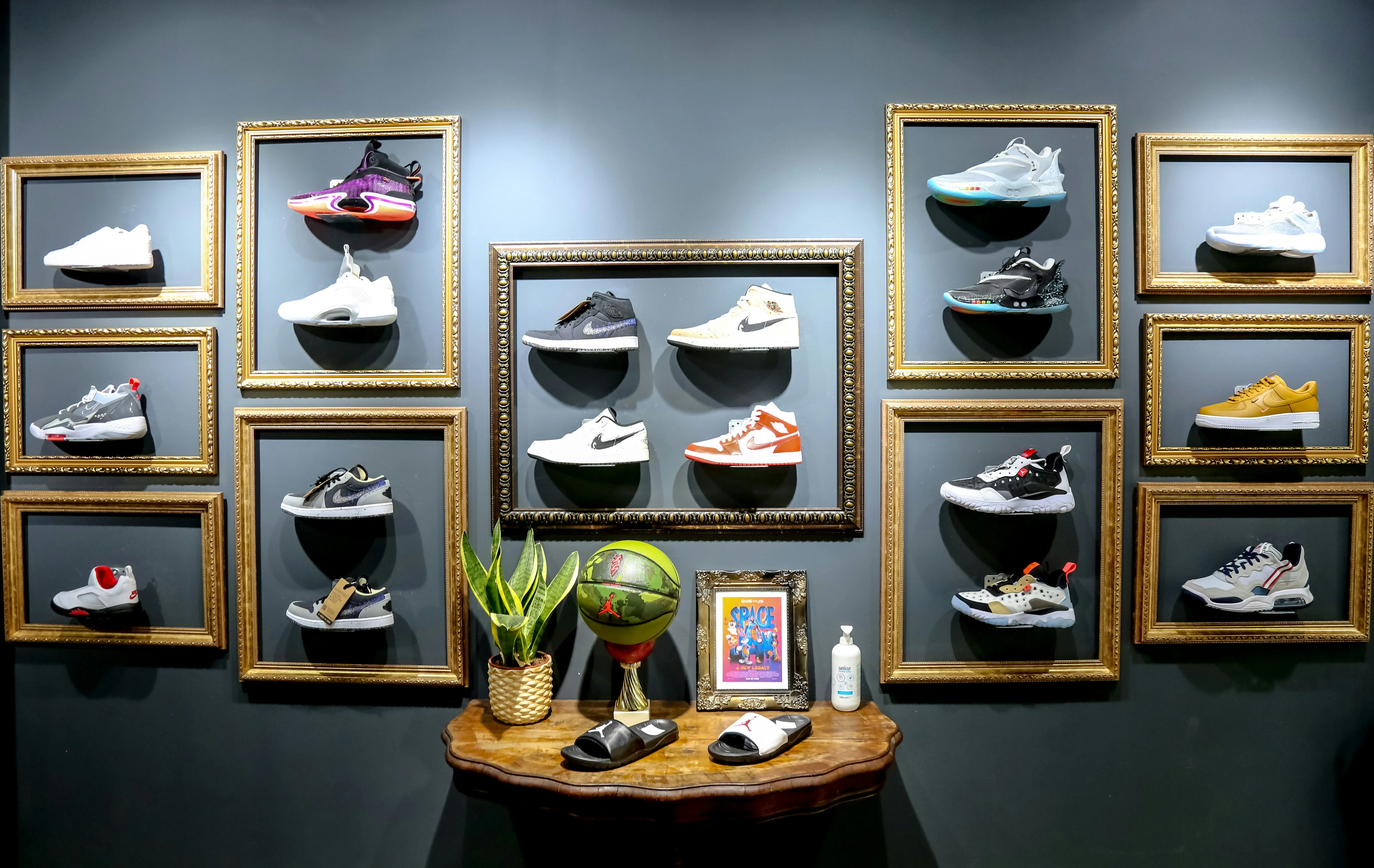 wooden-rack-on-wall-full-of-branded-shoes